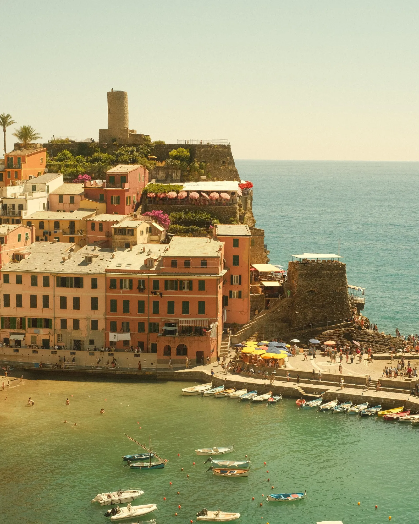 Vernazza harbour in the Cinque Terre shot with the Italian Summer Fujifilm recipe, warm pastel facades above turquoise water