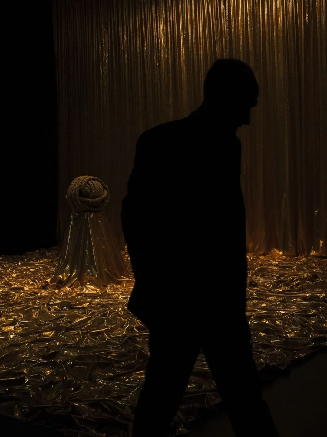 A silhouette inside Clair-obscur exhibition at the Bourse de Commerce, Pinault Collection, Paris.
